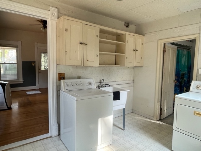 912 North 6th Street Rochelle, IL 61068 - Photo 10 of 34 a view of a kitchen with white cabinets and wooden floor