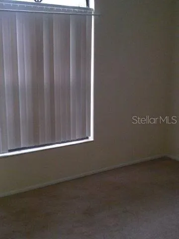 a view of a room that has a large window