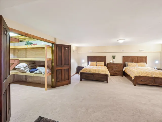 a living room with furniture flowerpot and a rug