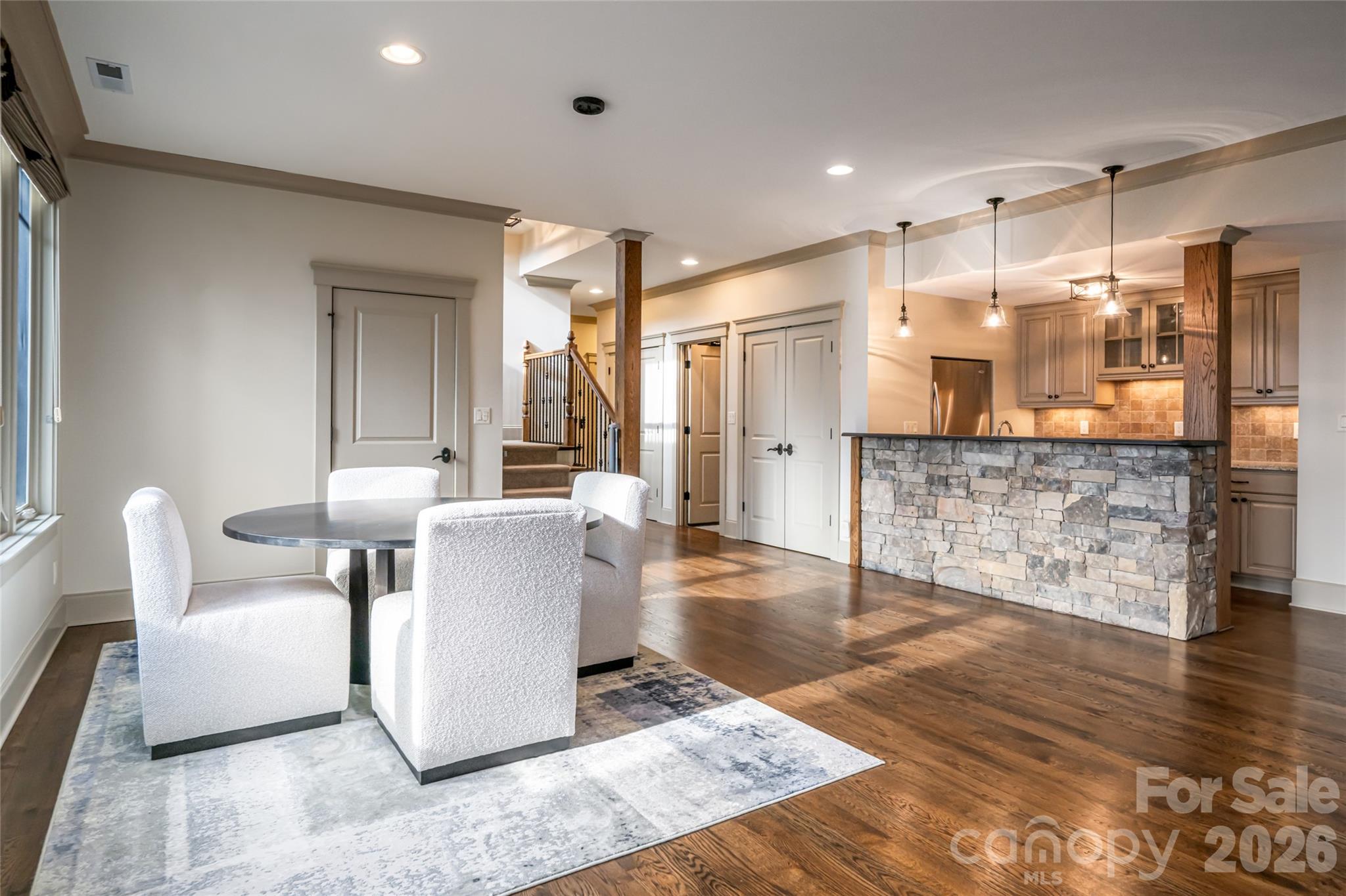 2 Cherokee Orchard Court Fairview, NC 28730 - Photo 32 of 47 a living room with couches and kitchen view with wooden floor
