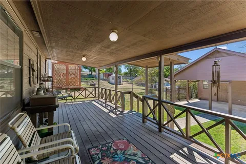 a view of a balcony with chairs