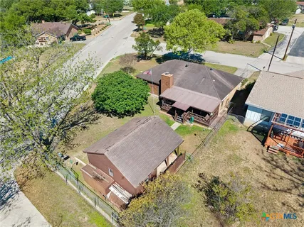 an aerial view of a house with outdoor space