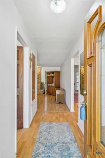 a living room with furniture and a rug