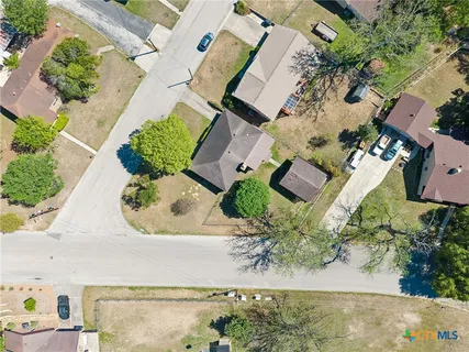 an aerial view of a house with outdoor space
