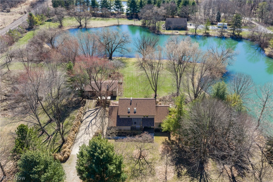 Aerial view of 3.6 acre property and beautiful stocked lake behind home