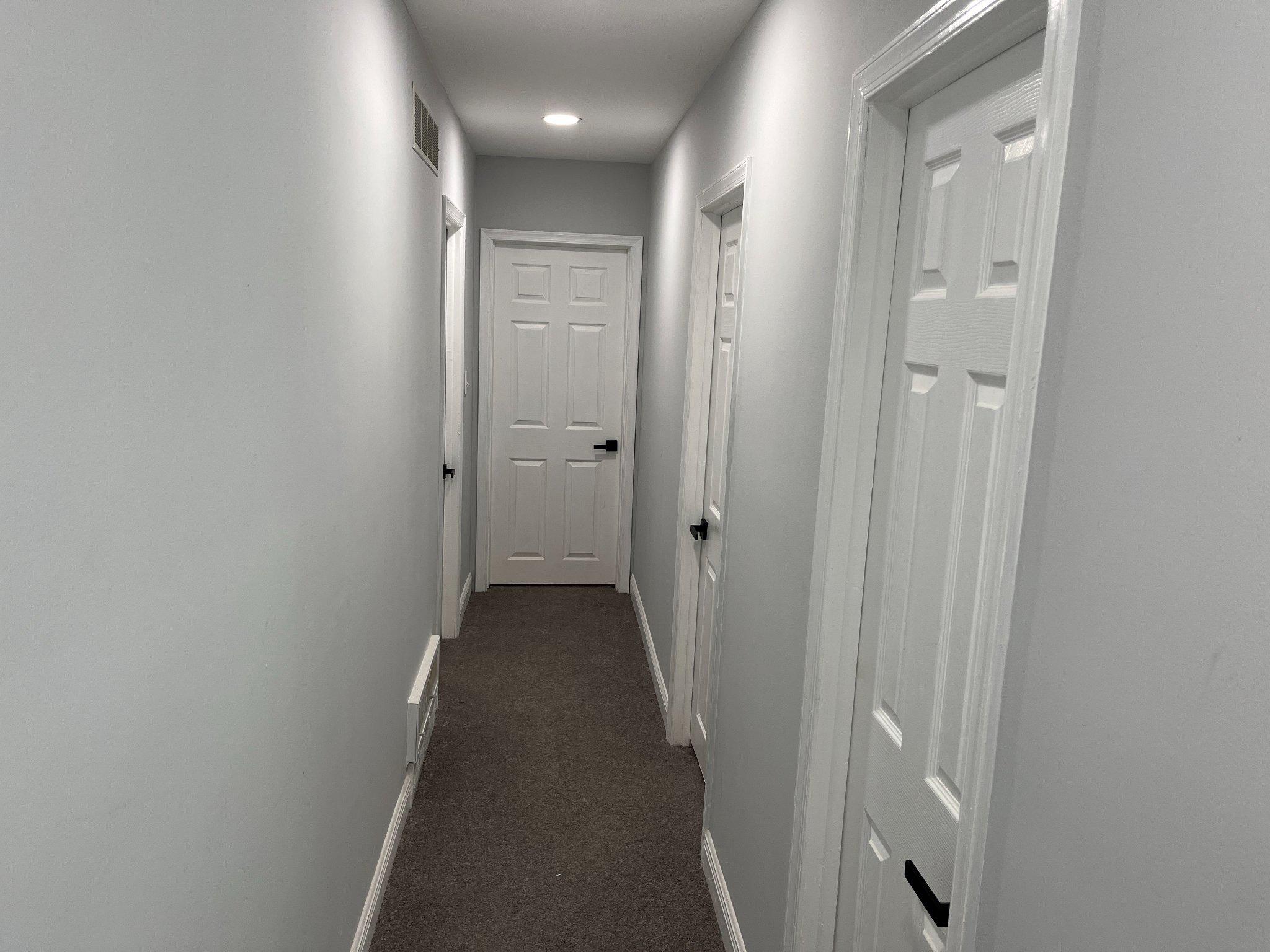 2405 Limestone Road Wilmington, DE 19808 - Photo 21 of 40 a view of a hallway with a wooden door