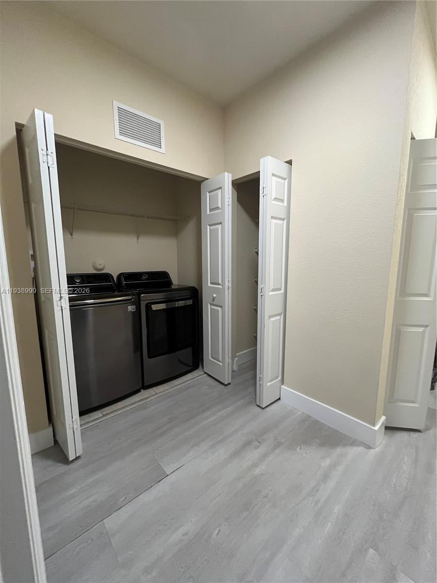 23218 Southwest 113 Passage Homestead, FL 33032 - Photo 13 of 23 an empty room with wooden floor