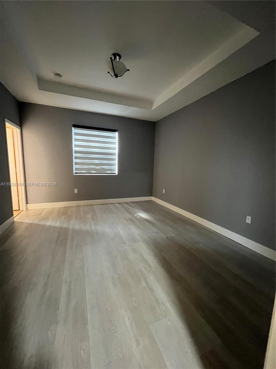 23218 Southwest 113 Passage Homestead, FL 33032 - Photo 16 of 23 a view of an empty room with a window