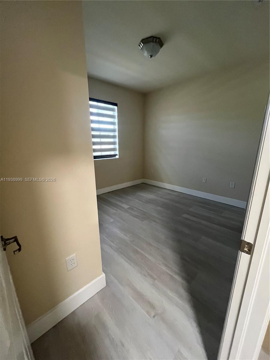 23218 Southwest 113 Passage Homestead, FL 33032 - Photo 18 of 23 an empty room with windows