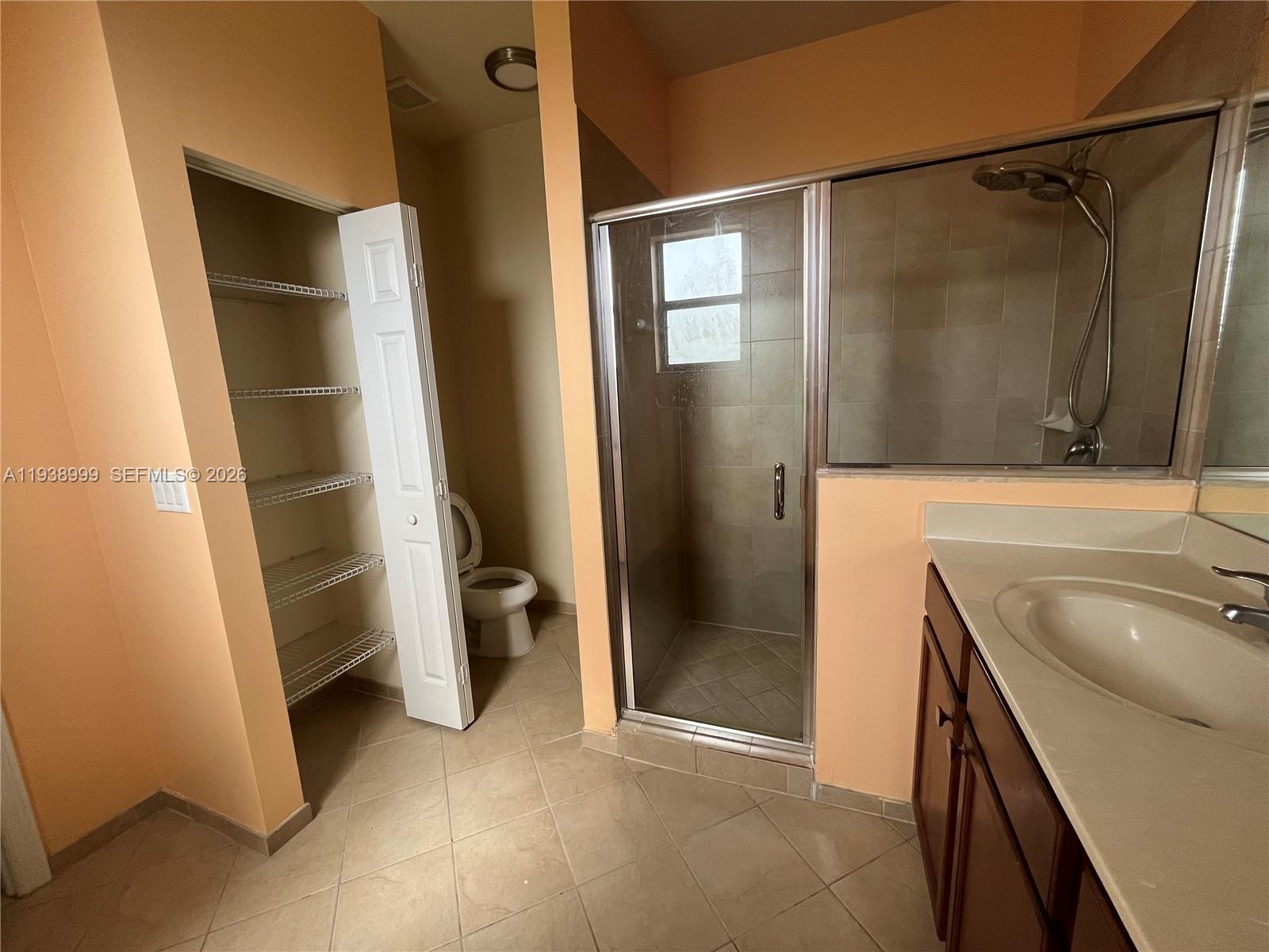 23218 Southwest 113 Passage Homestead, FL 33032 - Photo 9 of 23 a bathroom with a sink and a mirror