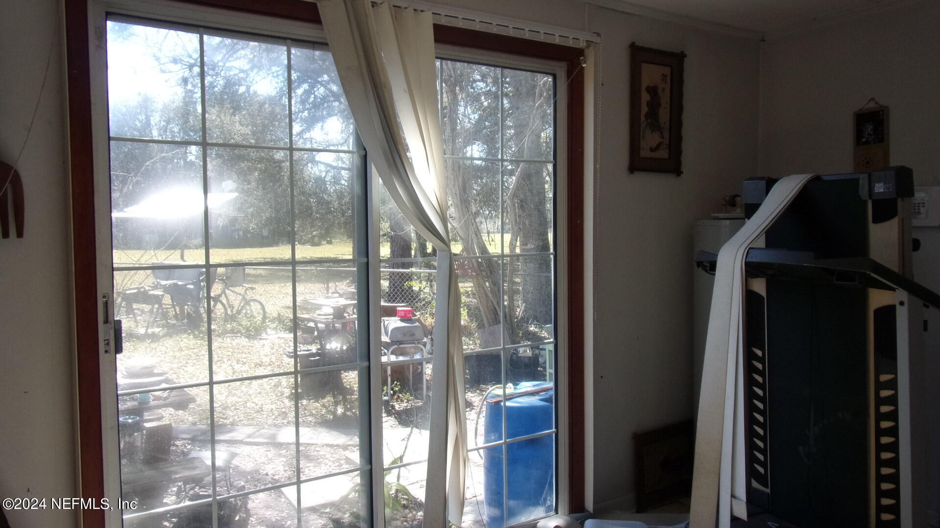 117 Odom Road Palatka, FL 32177 - Photo 11 of 20 a view of empty room with wooden floor and fan