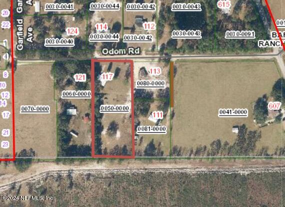 117 Odom Road Palatka, FL 32177 - Photo 19 of 20 a street sign is next to a building