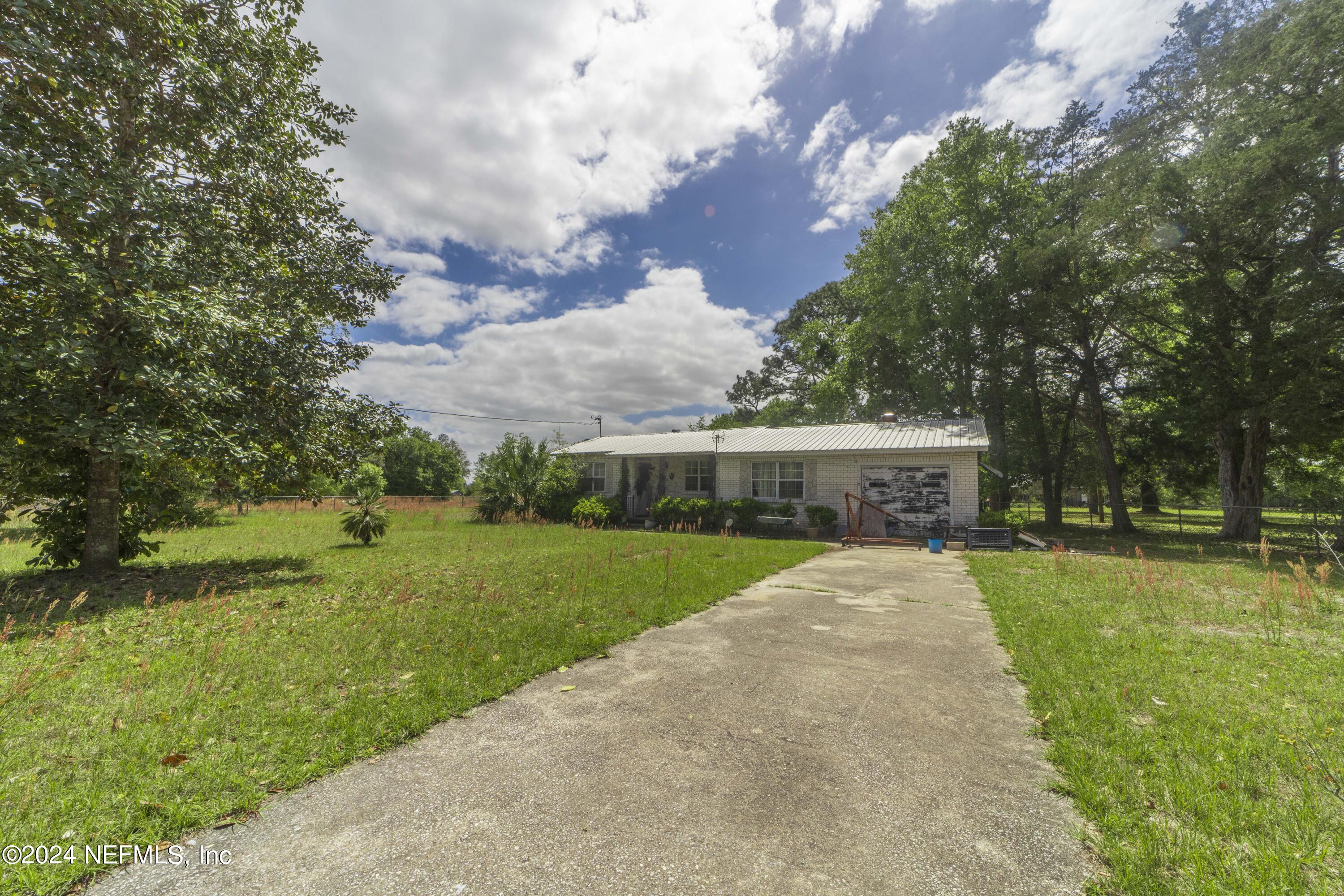 117 Odom Road Palatka, FL 32177 - Photo 2 of 20 a front view of house with yard and trees