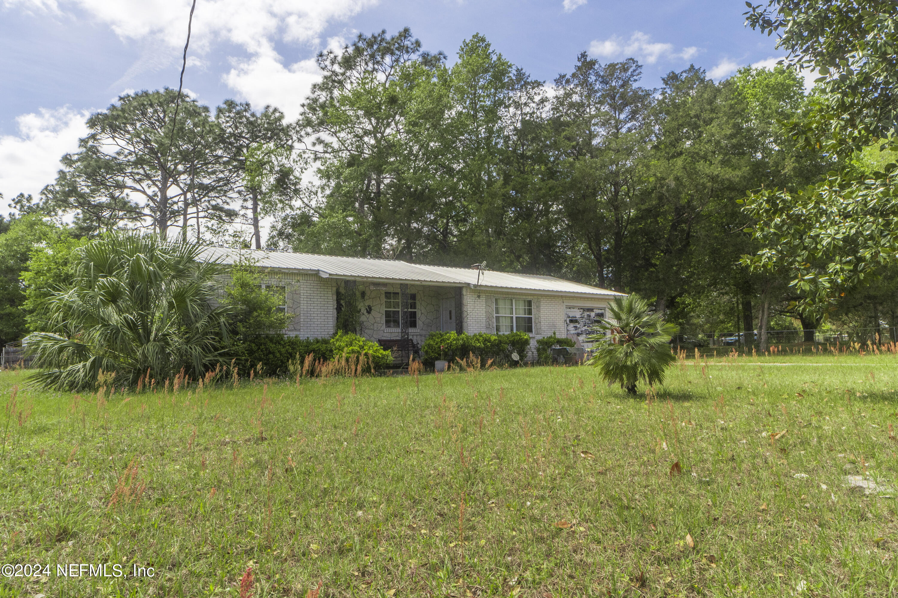 117 Odom Road Palatka, FL 32177 - Photo 3 of 20 a front view of a house with yard and green space