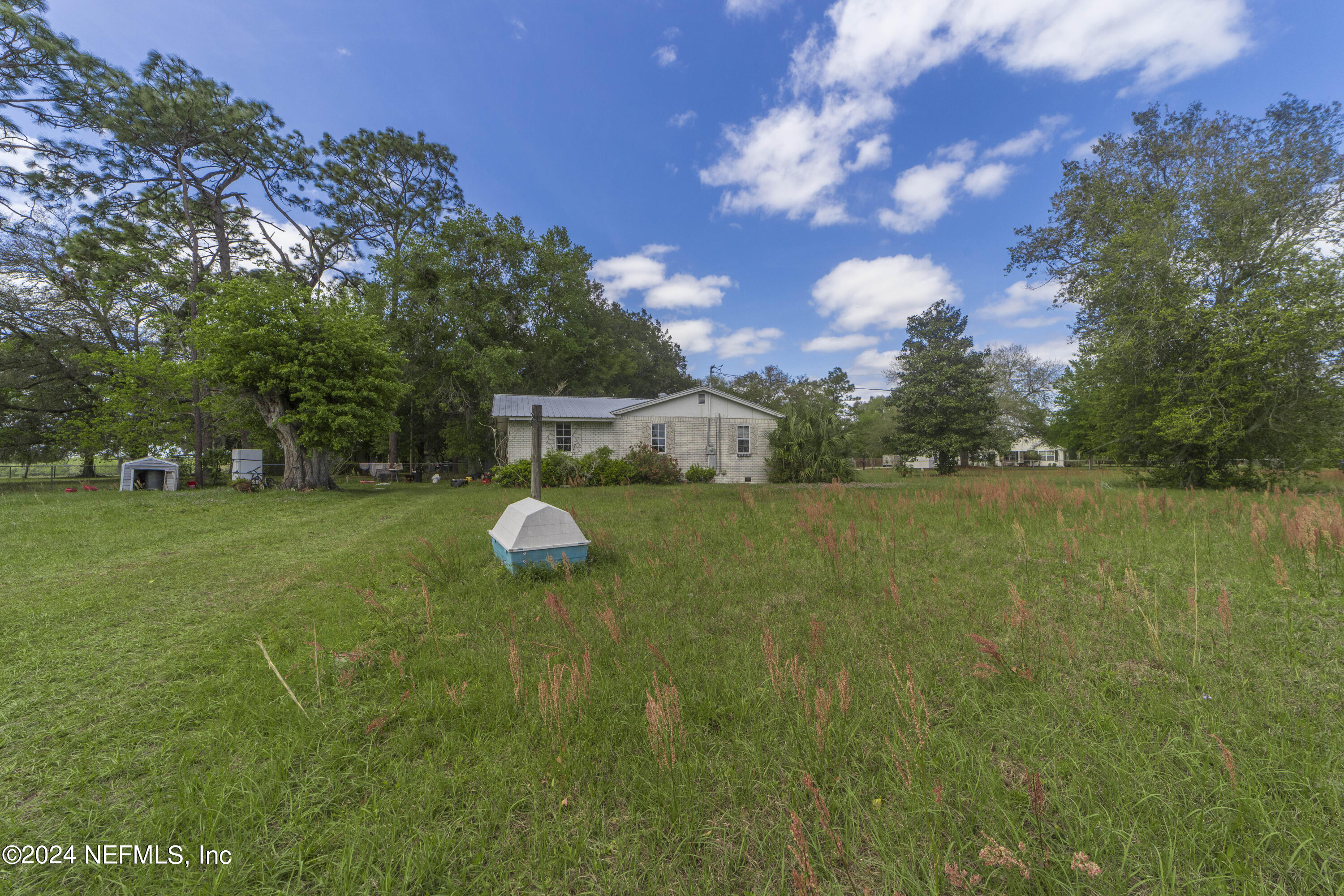 117 Odom Road Palatka, FL 32177 - Photo 5 of 20 a view of a golf course with a lake