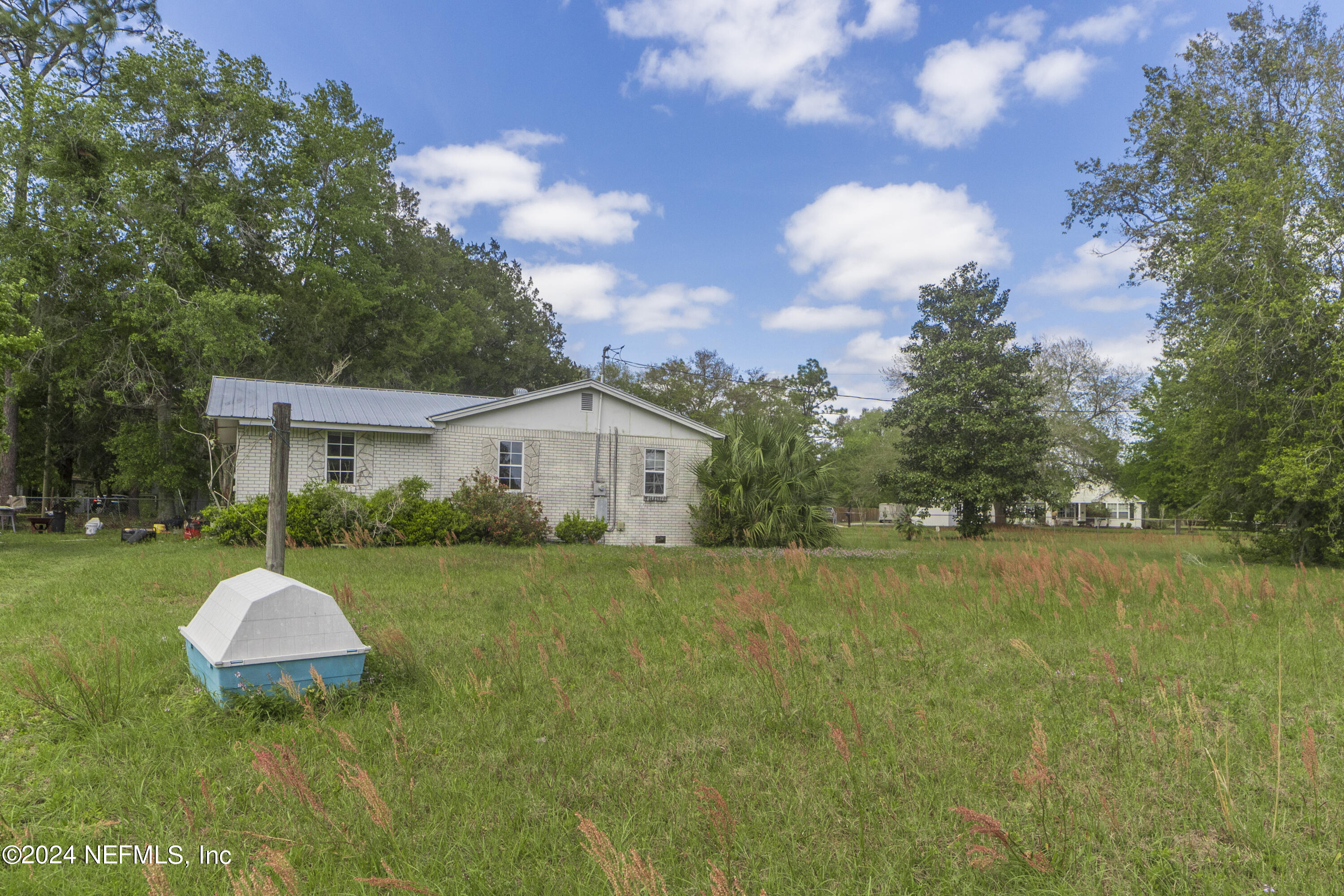 117 Odom Road Palatka, FL 32177 - Photo 6 of 20 a view of a house with backyard and garden