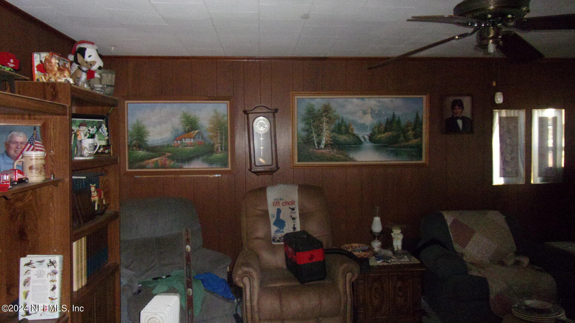 117 Odom Road Palatka, FL 32177 - Photo 9 of 20 a living room with furniture and a flat screen tv