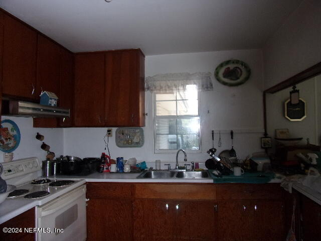 117 Odom Road Palatka, FL 32177 - Photo 10 of 20 a kitchen with sink a stove and cabinets