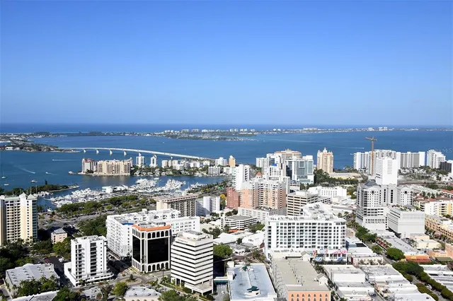 a front view of a house with a lake view