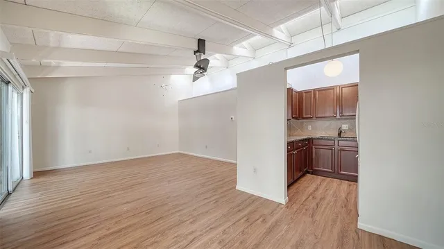 a view of a kitchen and a sink wooden floor