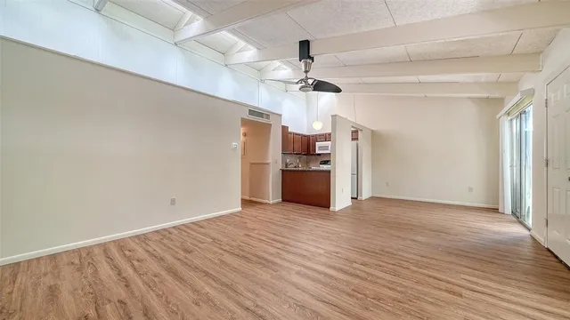 a kitchen with granite countertop a sink and cabinets