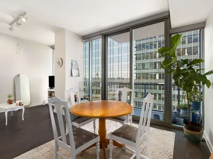 a view of a dining room with furniture and window