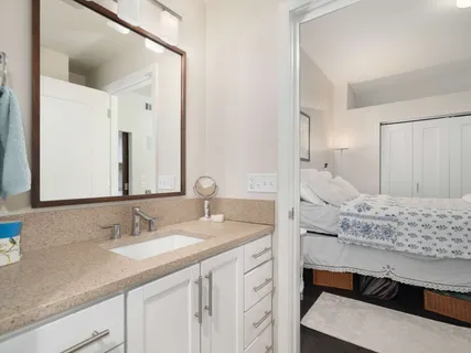 a bathroom with a sink double vanity and a mirror