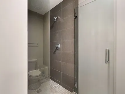 a bathroom with a granite countertop toilet