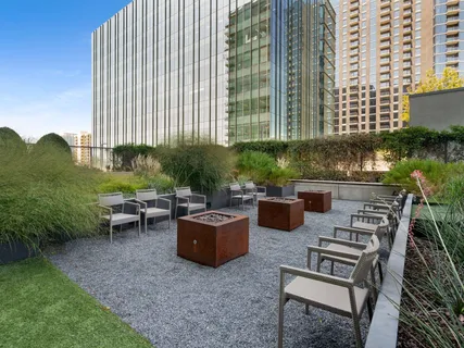 a room with gym equipment and large windows