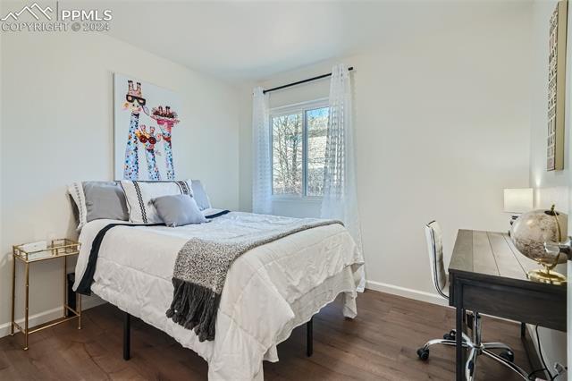 8234 Linderman Road Peyton, CO 80831 - Photo 11 of 24 Bedroom featuring hardwood / wood-style flooring