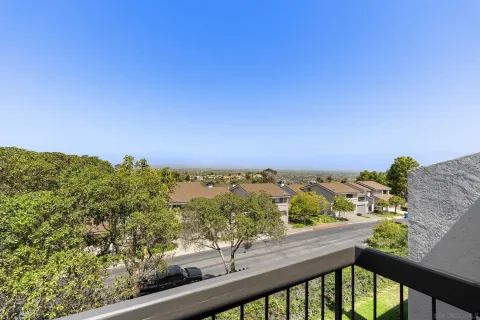 an aerial view of residential building and trees around