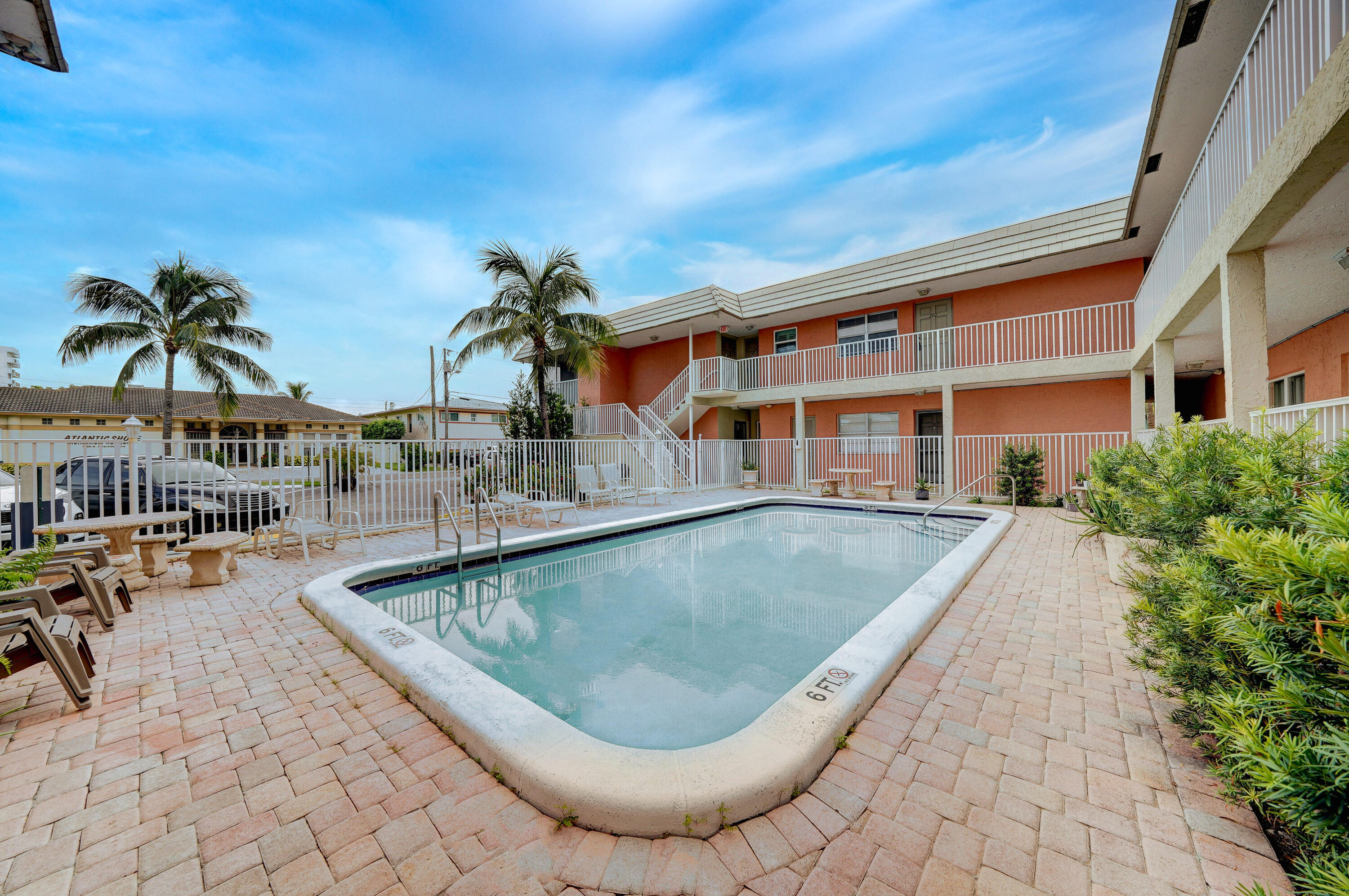 a view of a swimming pool with a lounge chairs
