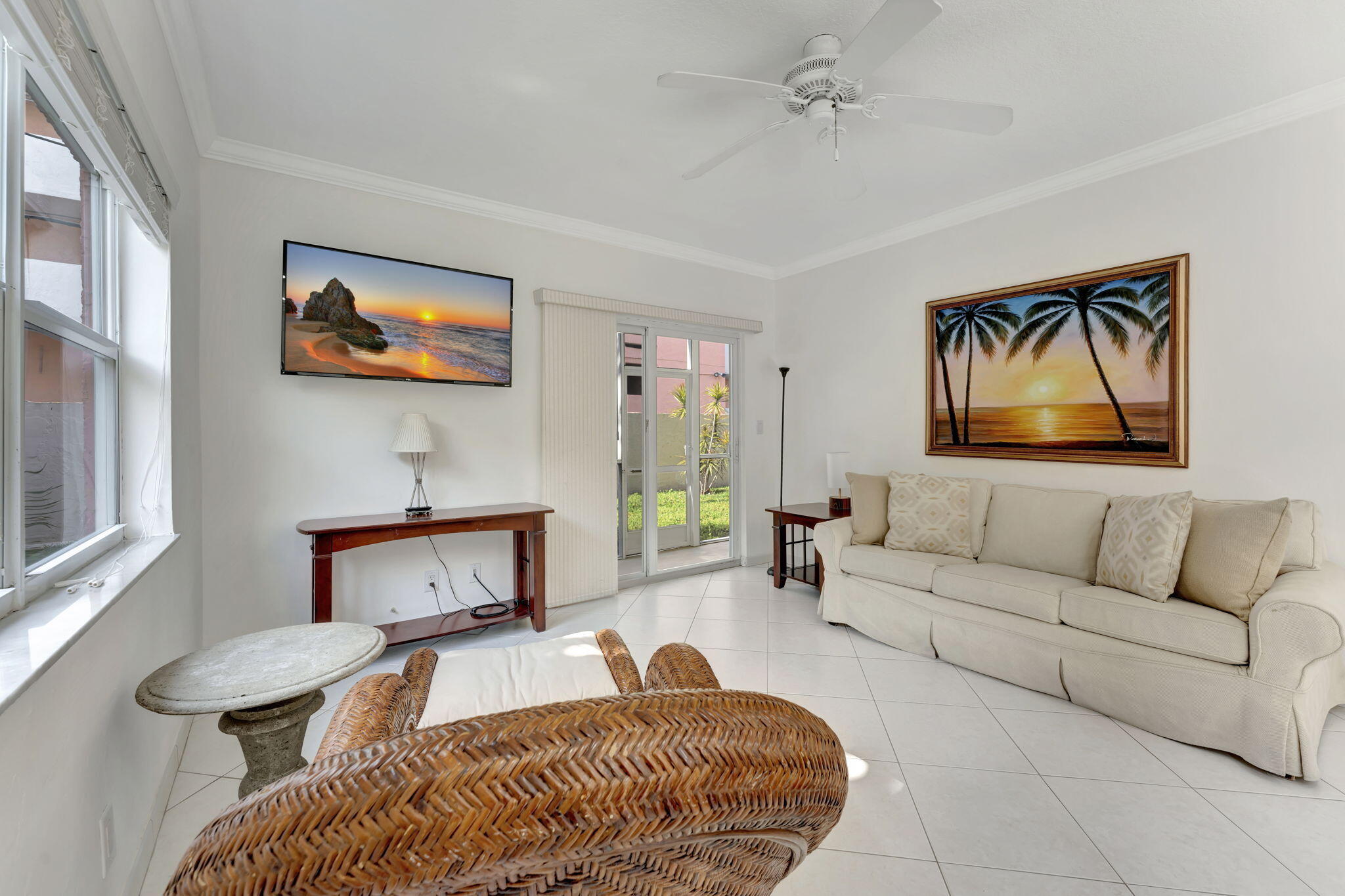 1450 North Riverside Drive, Unit 103 Pompano Beach, FL 33062 - Photo 12 of 34 a bedroom with furniture and a fireplace