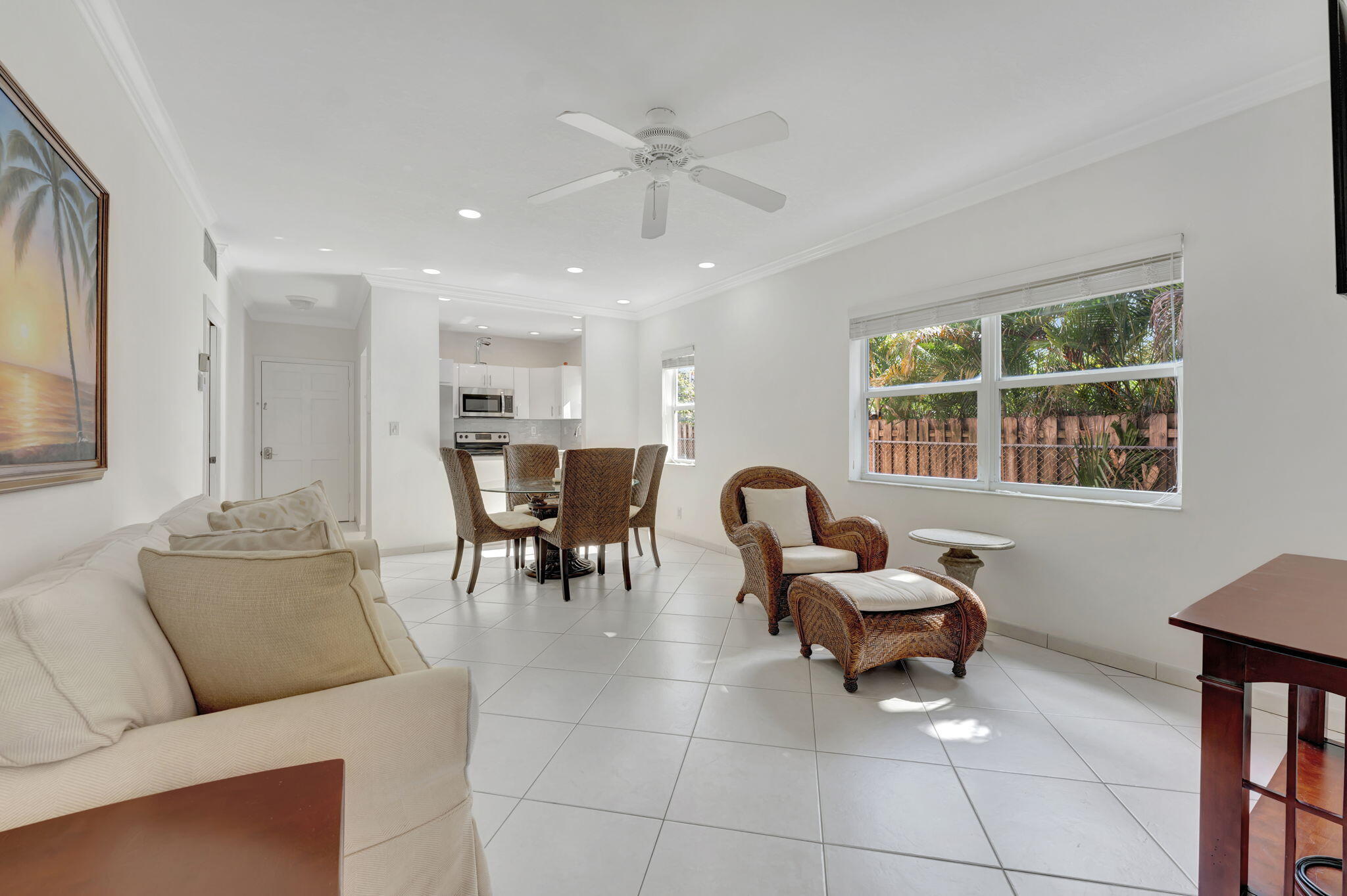 1450 North Riverside Drive, Unit 103 Pompano Beach, FL 33062 - Photo 13 of 34 a living room with furniture and a large window
