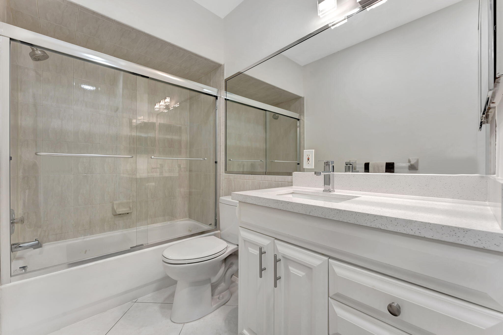 1450 North Riverside Drive, Unit 103 Pompano Beach, FL 33062 - Photo 18 of 34 a bathroom with a sink a toilet and shower