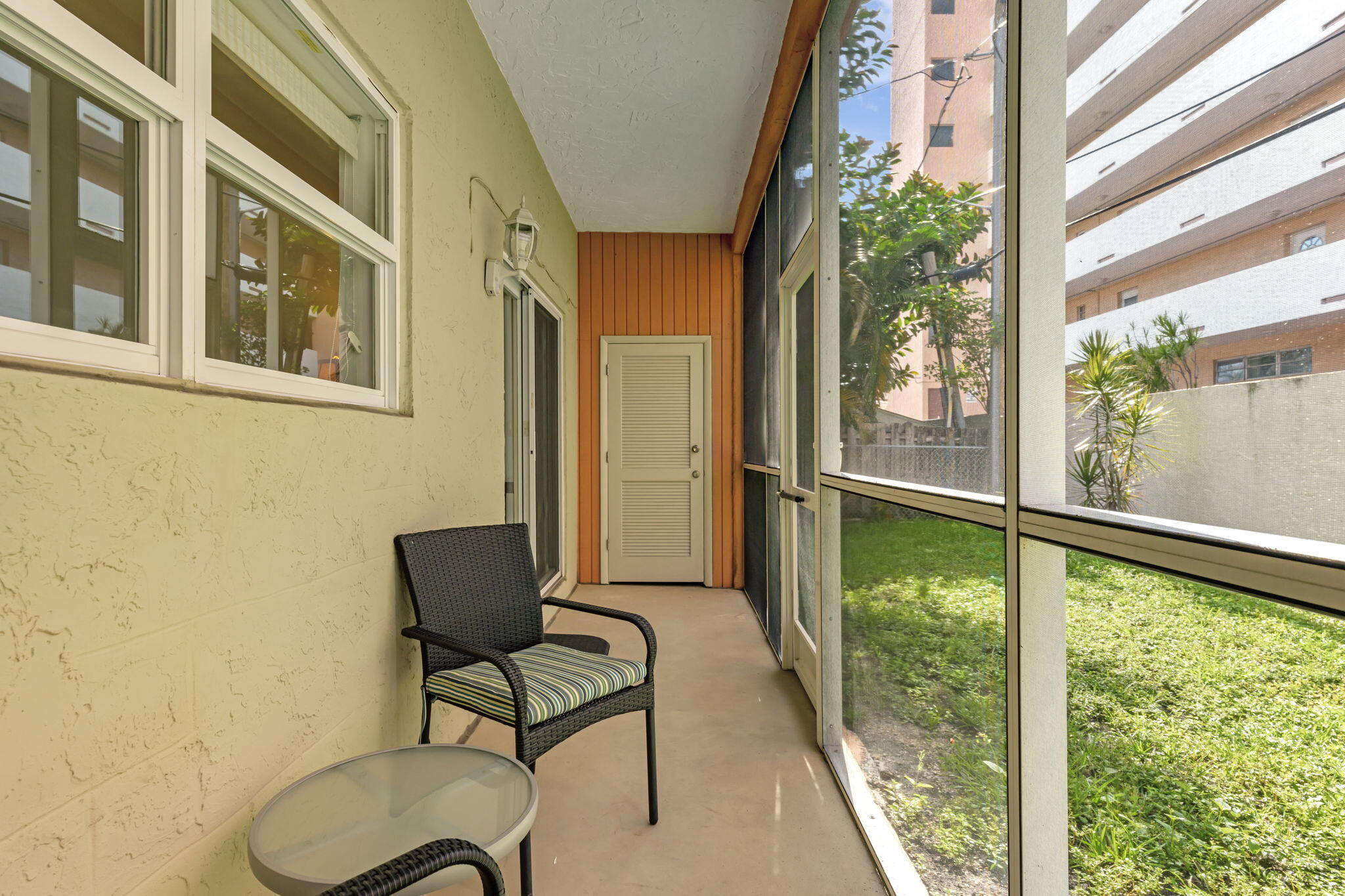 1450 North Riverside Drive, Unit 103 Pompano Beach, FL 33062 - Photo 19 of 34 a balcony view with a couch and table