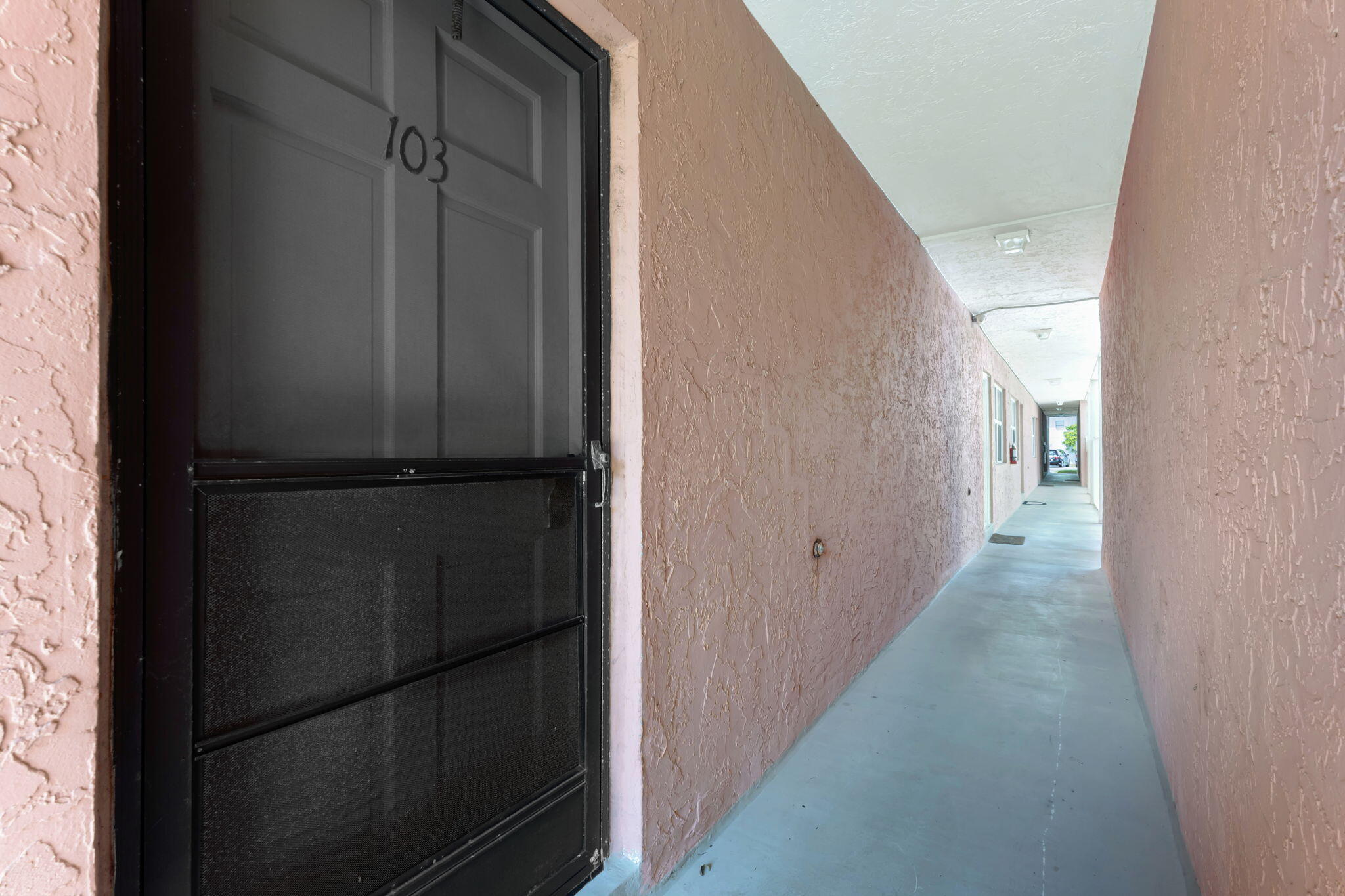 1450 North Riverside Drive, Unit 103 Pompano Beach, FL 33062 - Photo 6 of 34 a view of a hallway