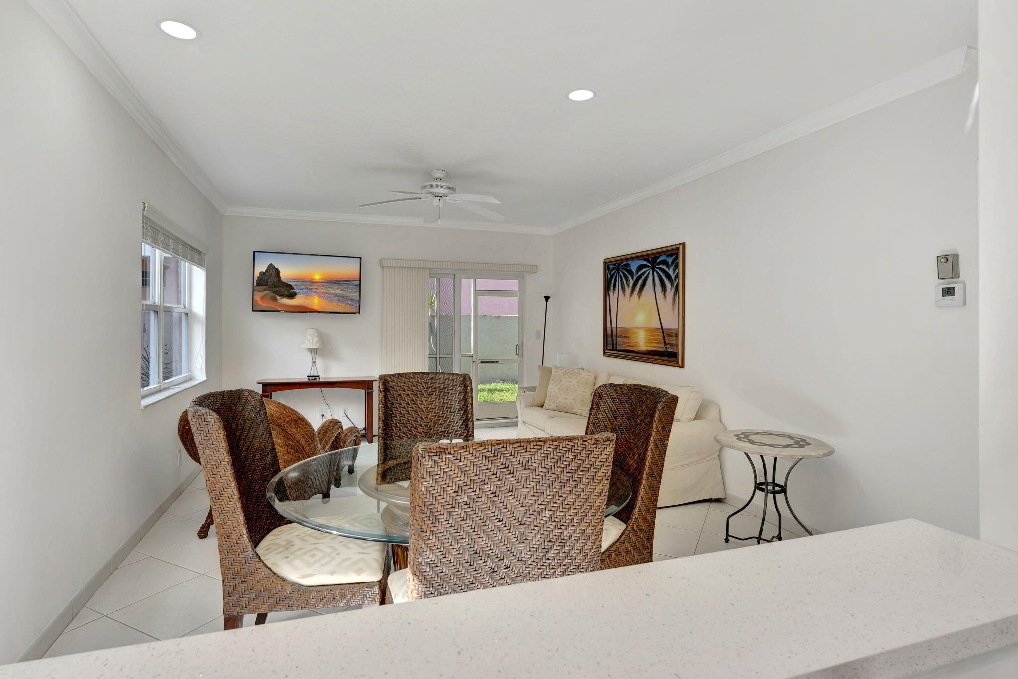 1450 North Riverside Drive, Unit 103 Pompano Beach, FL 33062 - Photo 9 of 34 a living room with furniture and a chair