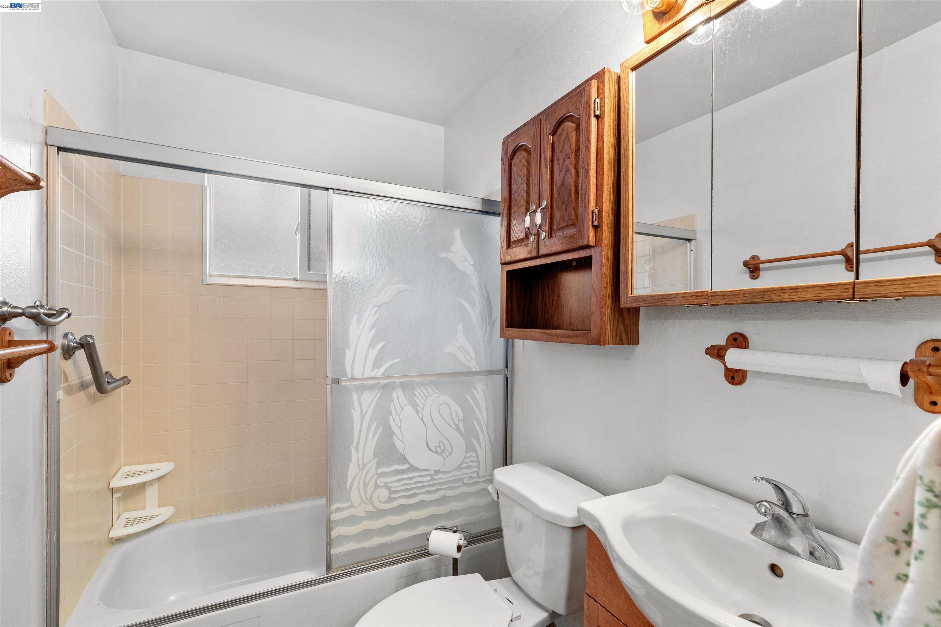 953 Thomsen Road Lathrop, CA 95330 - Photo 24 of 49 a bathroom with a sink a toilet and shower