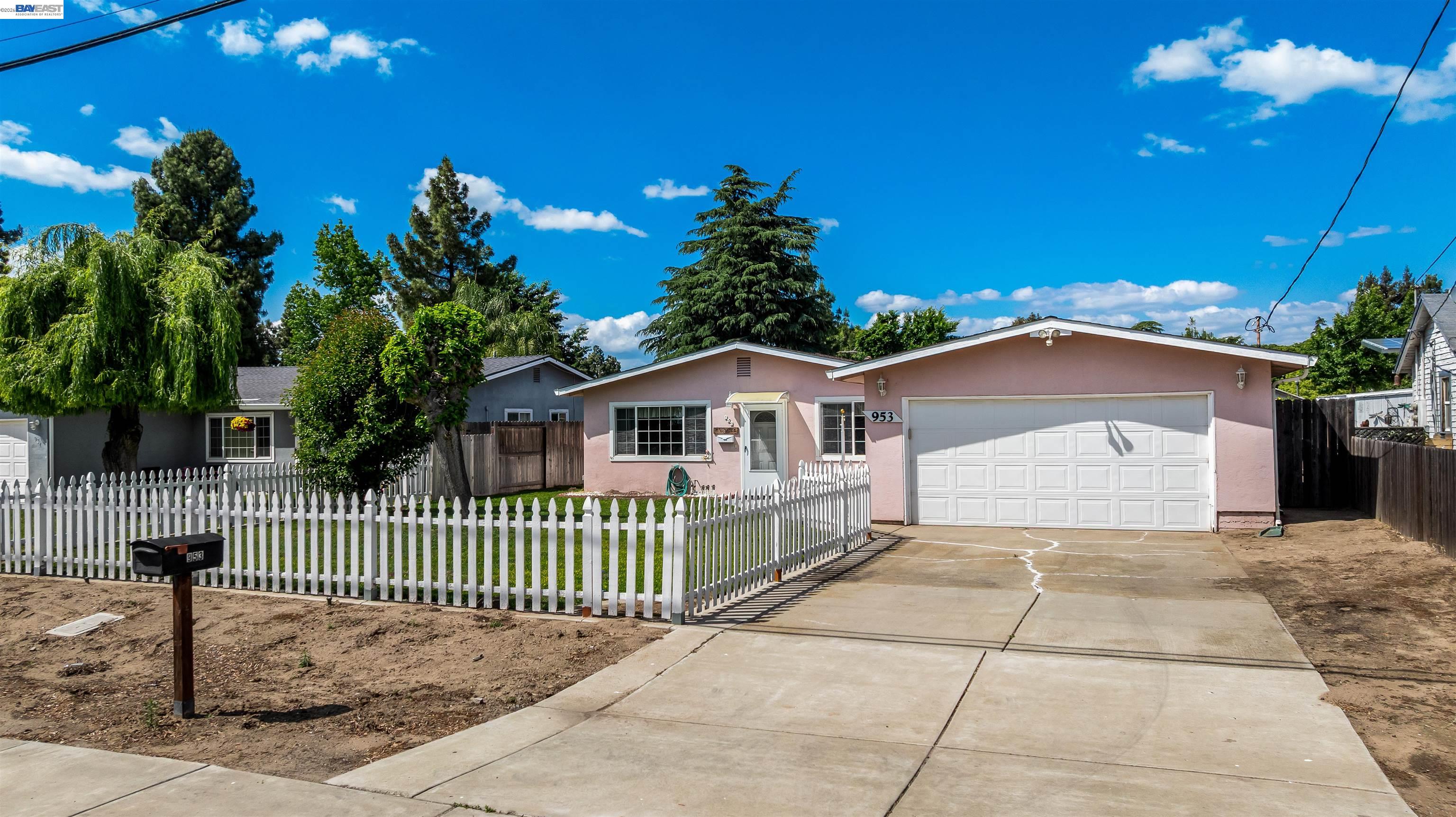 953 Thomsen Road Lathrop, CA 95330 - Photo 3 of 49 a front view of a house with a garage