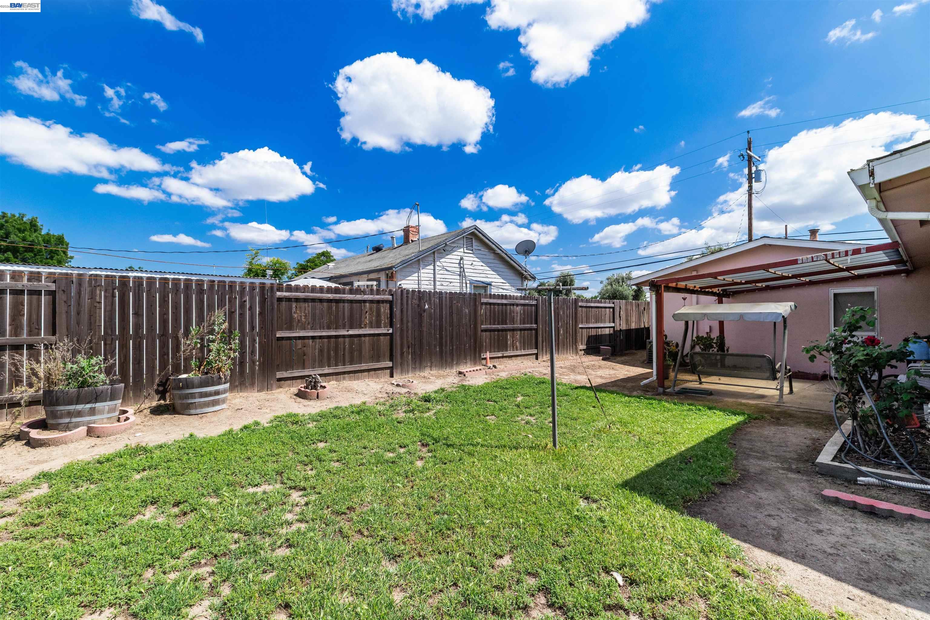 953 Thomsen Road Lathrop, CA 95330 - Photo 33 of 49 a view of a house with backyard and sitting area