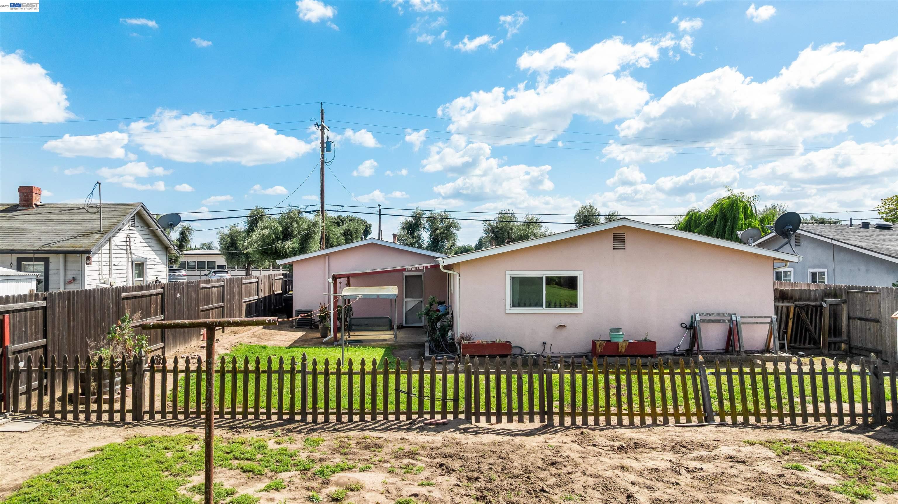 953 Thomsen Road Lathrop, CA 95330 - Photo 34 of 49 a front view of a house with a garden