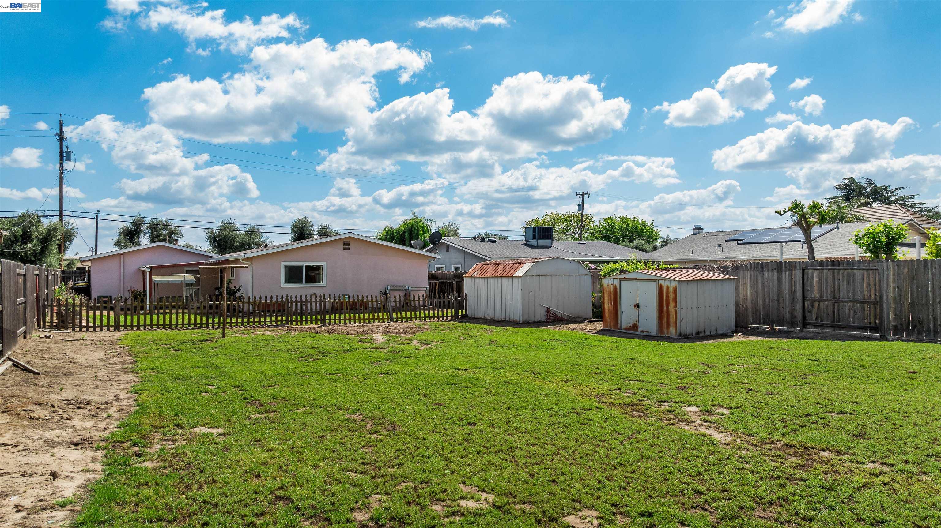 953 Thomsen Road Lathrop, CA 95330 - Photo 36 of 49 a view of a house with a yard and sitting area