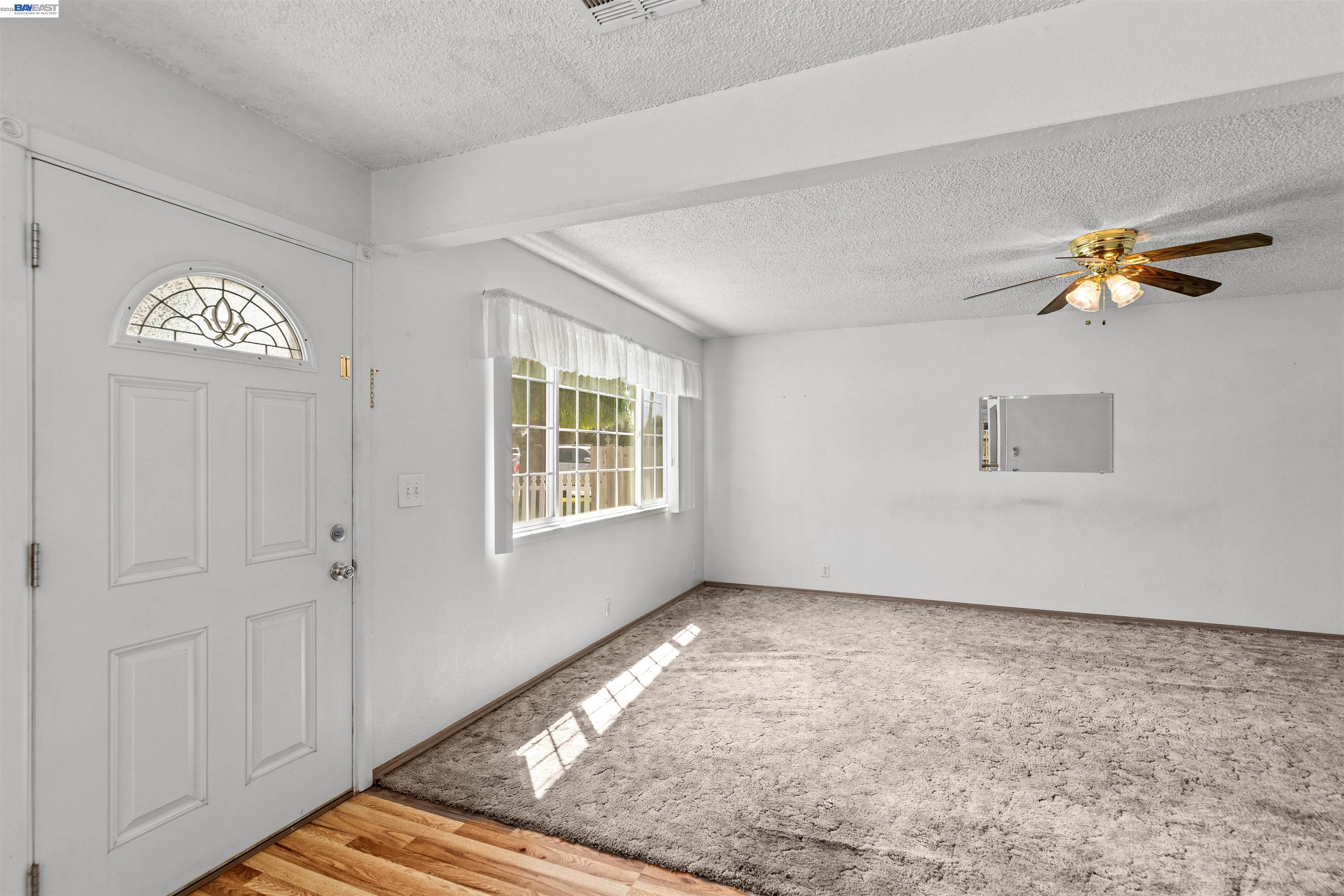 953 Thomsen Road Lathrop, CA 95330 - Photo 8 of 49 an empty room with windows