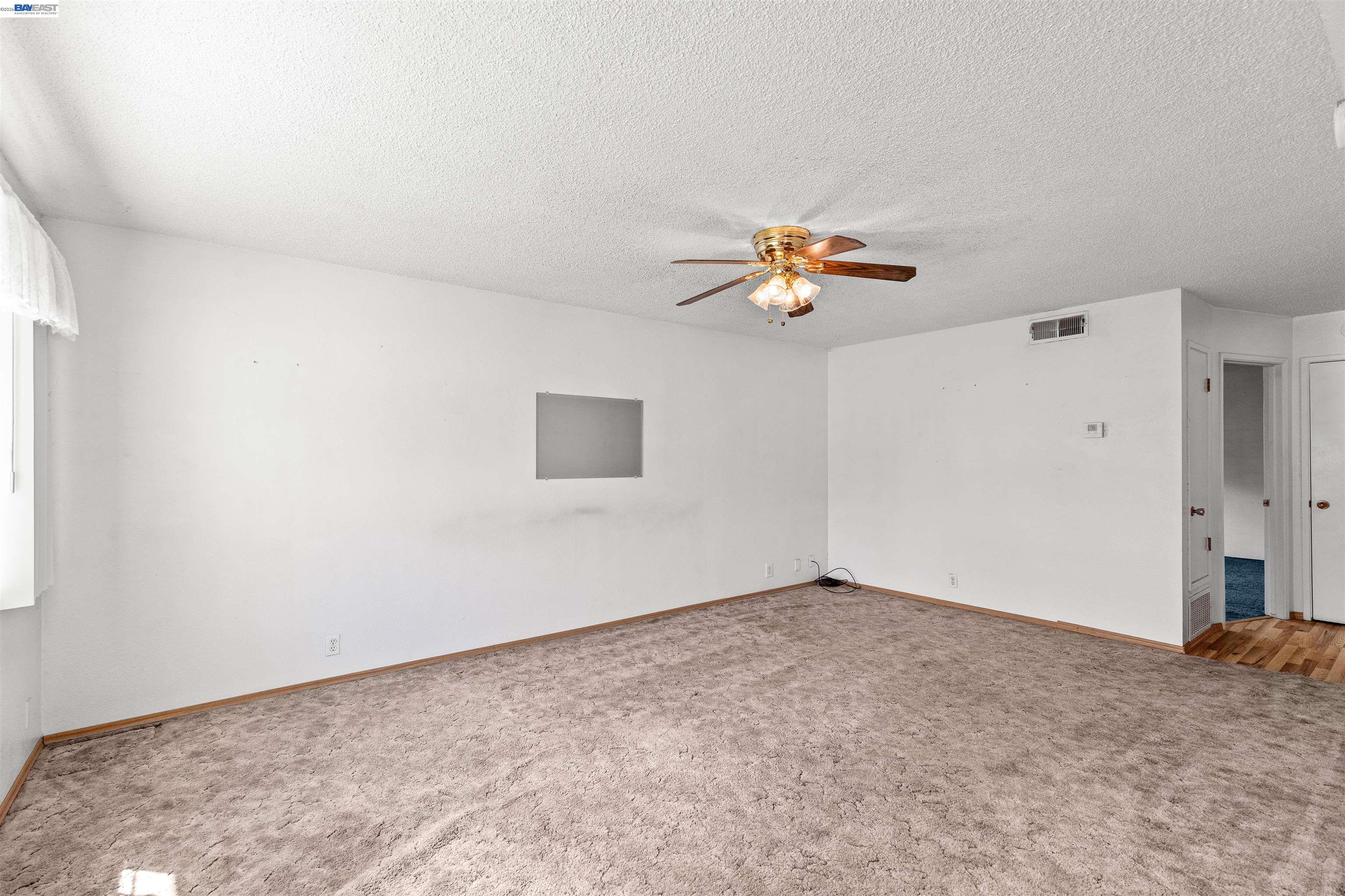 953 Thomsen Road Lathrop, CA 95330 - Photo 9 of 49 an empty room with a window