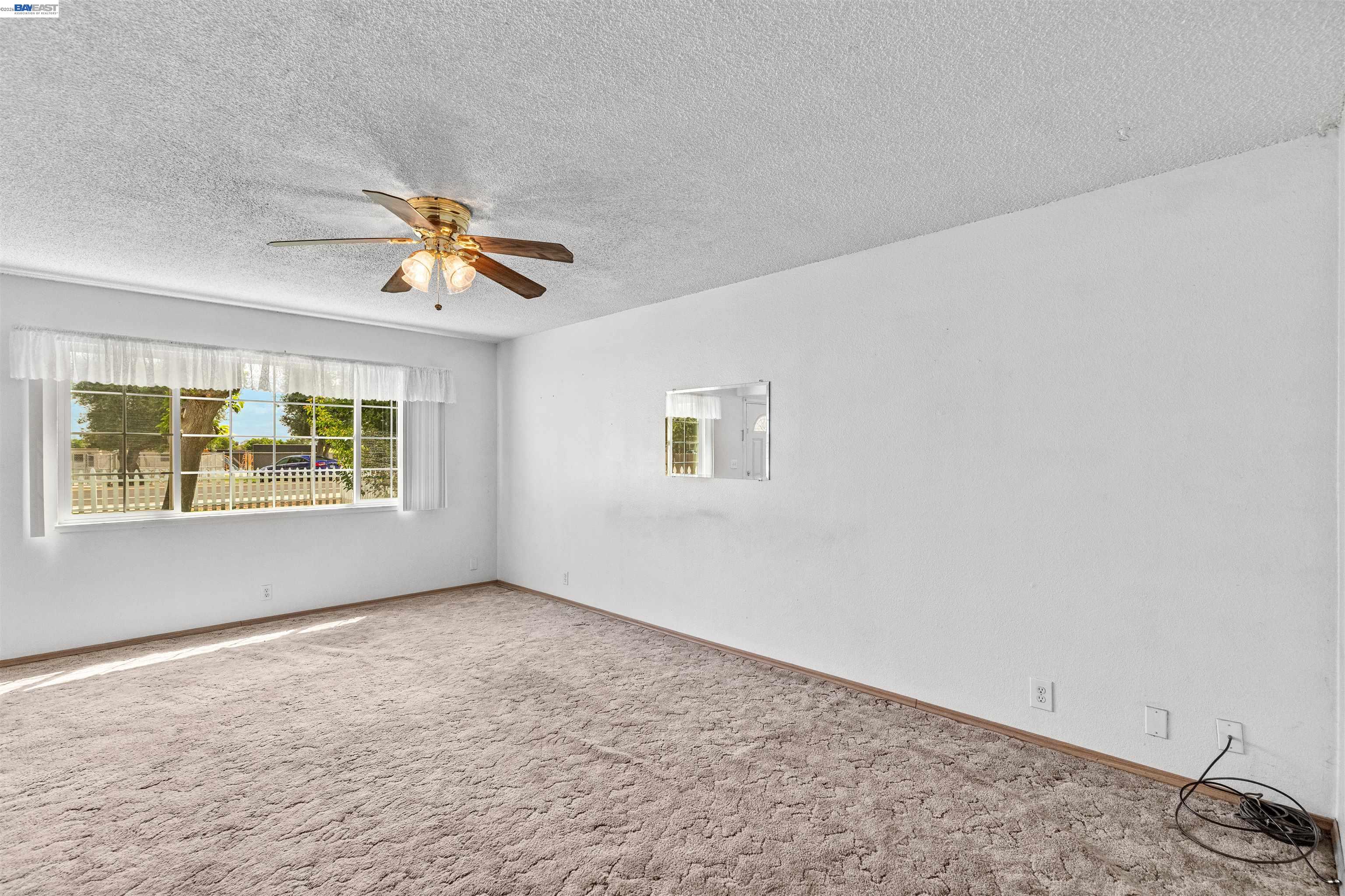 953 Thomsen Road Lathrop, CA 95330 - Photo 10 of 49 a view of an empty room with a window