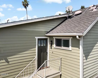 a bathroom with a granite countertop toilet sink and mirror