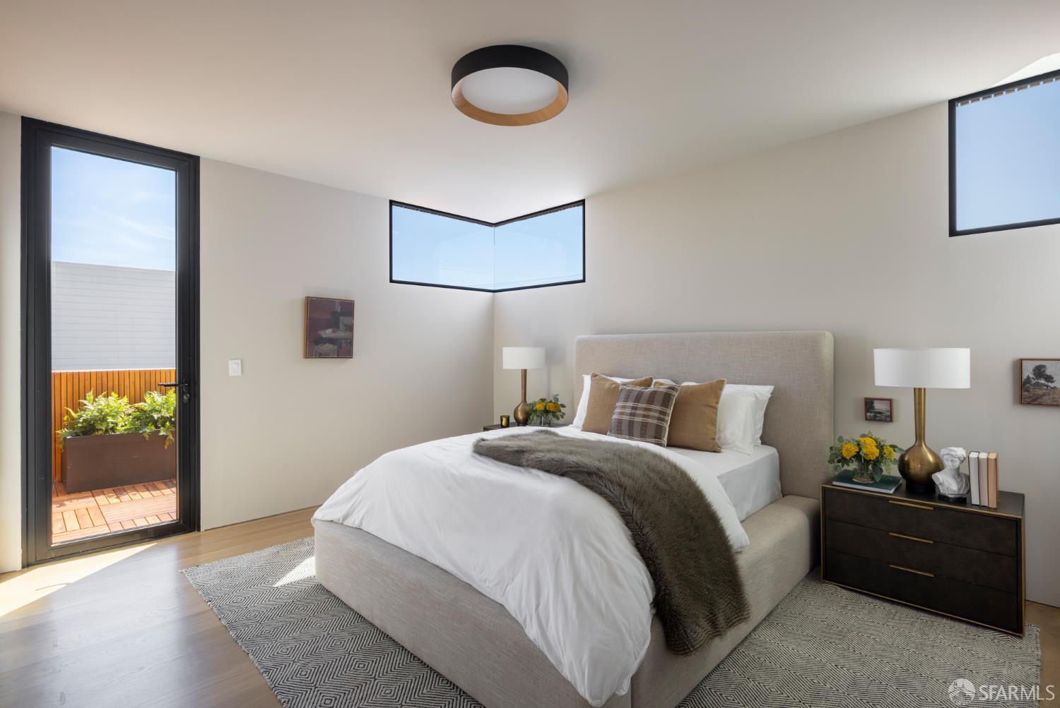 1864 Greenwich Street San Francisco, CA 94123 - Photo 11 of 27 a bedroom with a bed and painting on the wall