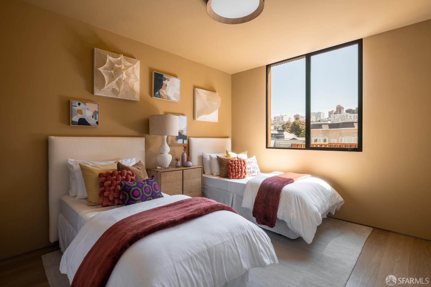 1864 Greenwich Street San Francisco, CA 94123 - Photo 12 of 27 a bedroom with two beds and painting on the wall