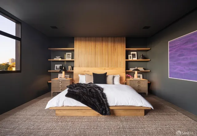 a bedroom with a bed lamp closet and window